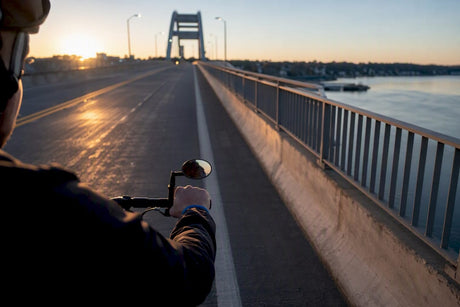 Commuter cyclist checking traffic with helmet mirror