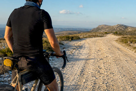 Gravel cyclist on a loose trail