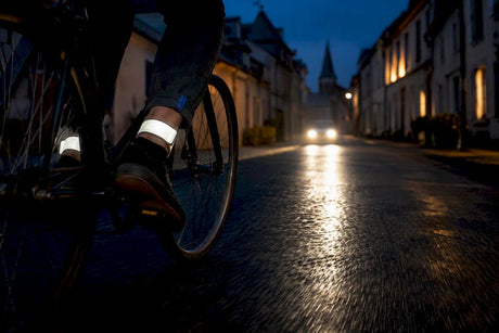 Cyclist wearing ankle reflectors at dusk