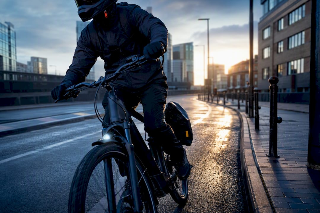 E-bike commuter wearing full-face helmet