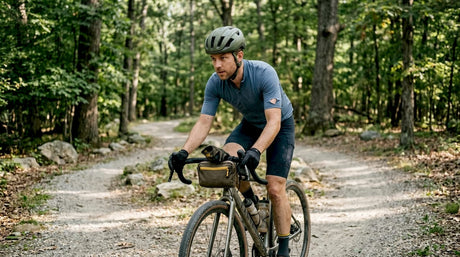 Cyclist riding gravel trail with helmet