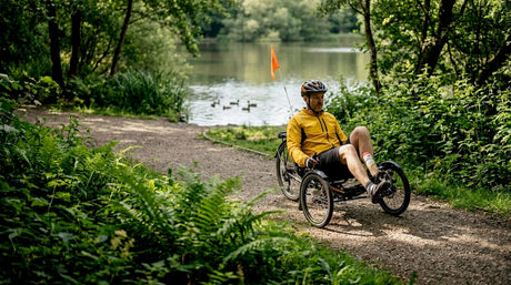 Adaptive cyclist riding in city park