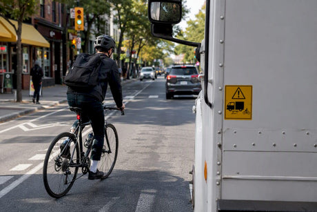 Urban cyclist avoiding truck blind-spot
