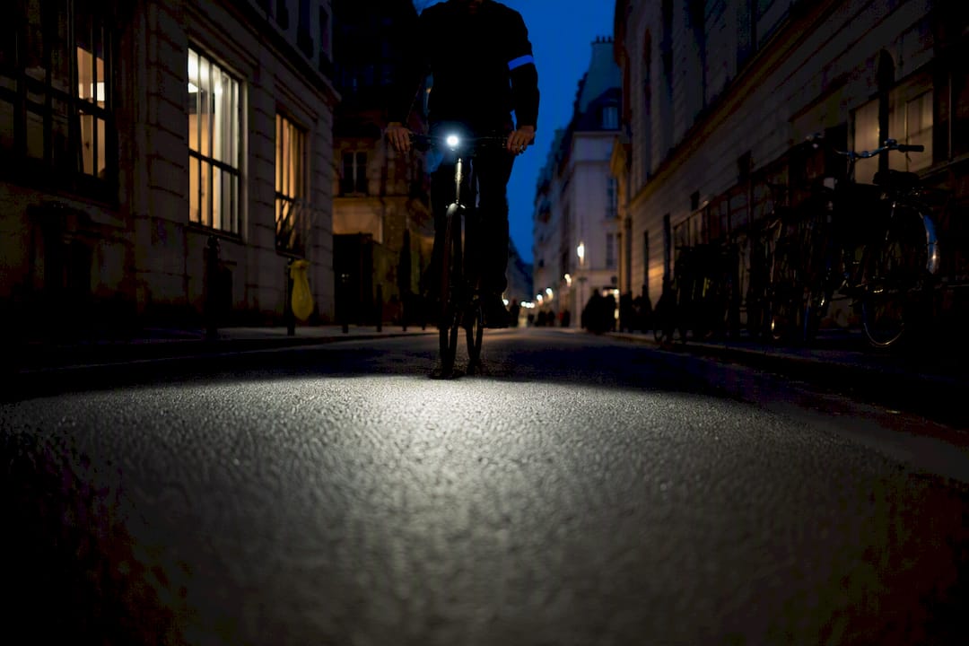 Cyclist illuminating French city street