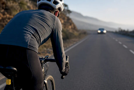 Cyclist monitoring traffic on open road